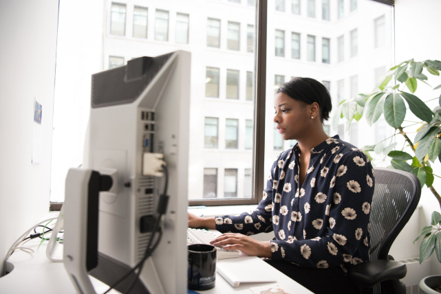 woman-working-using-desktop-computer-data-security-ciphertex-data-security-usa
